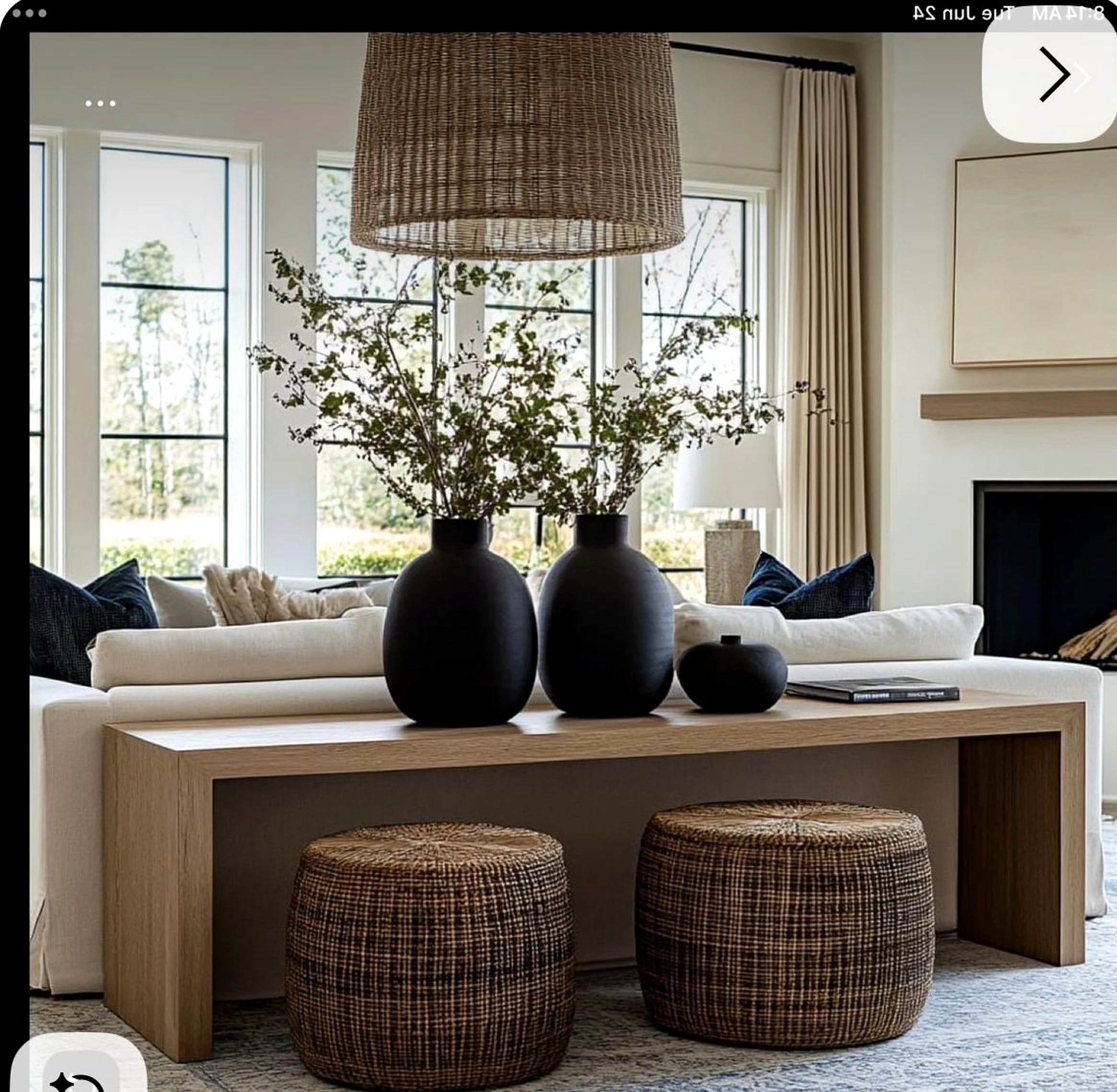 Quiet flower arrangement gives the corner more depth, so the whole view feels personal and relaxed.