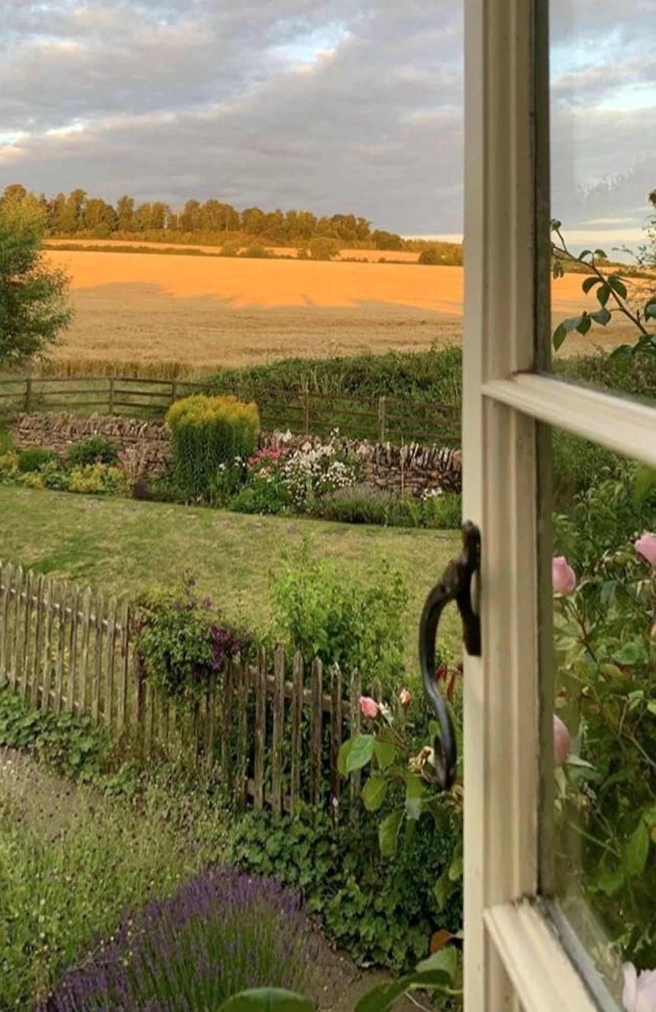 Luminous painted door supports the composition through freshness, leaving the space feeling open and lived-in.