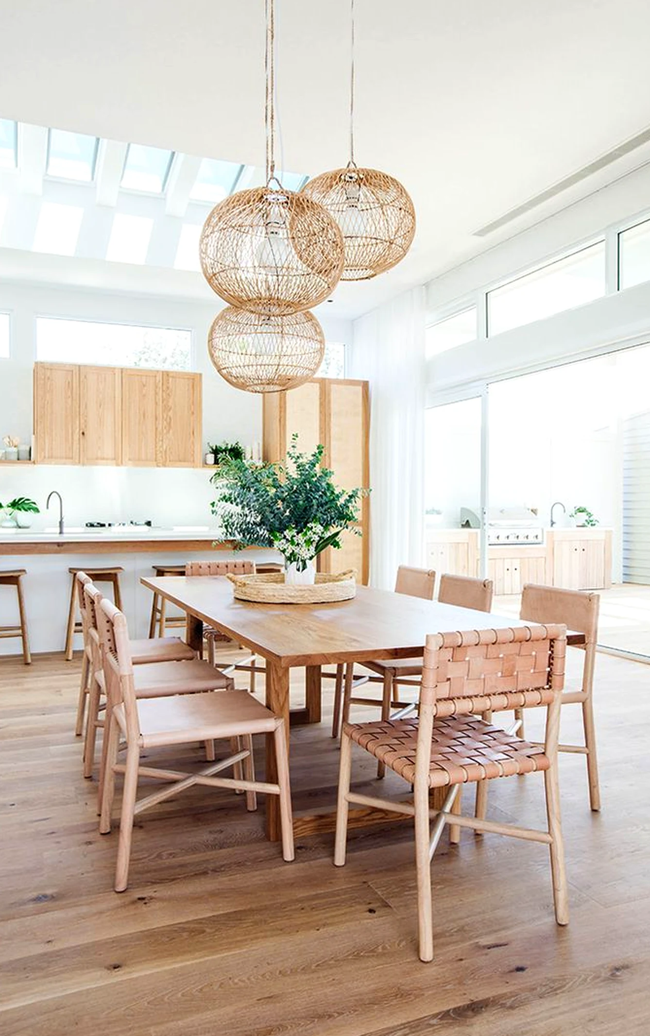 Warm terrace table anchors the design with depth, giving the view a mood that feels clear and inviting.