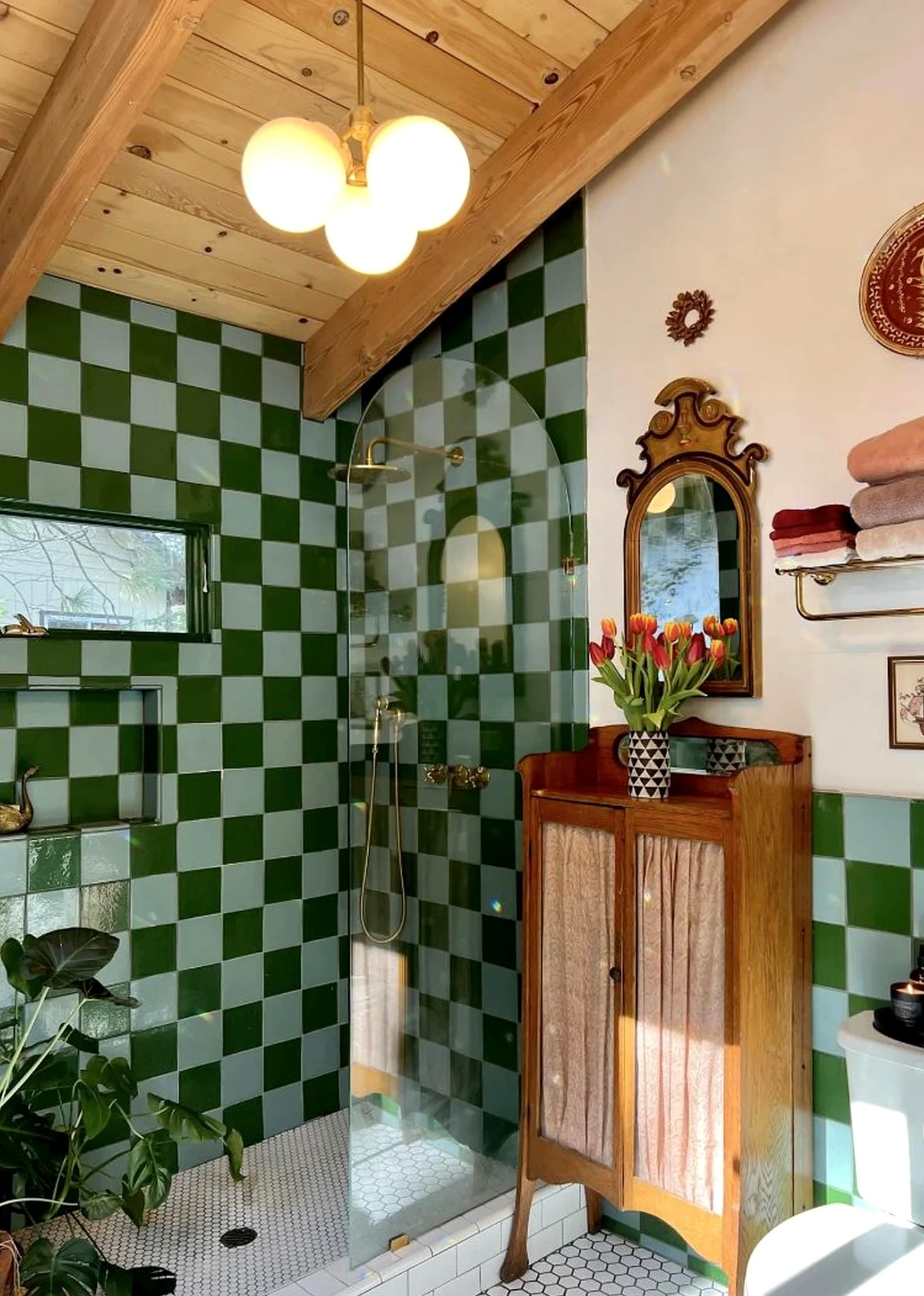 Graceful shower wall brings depth to the setting, creating a mood that feels visually grounded.