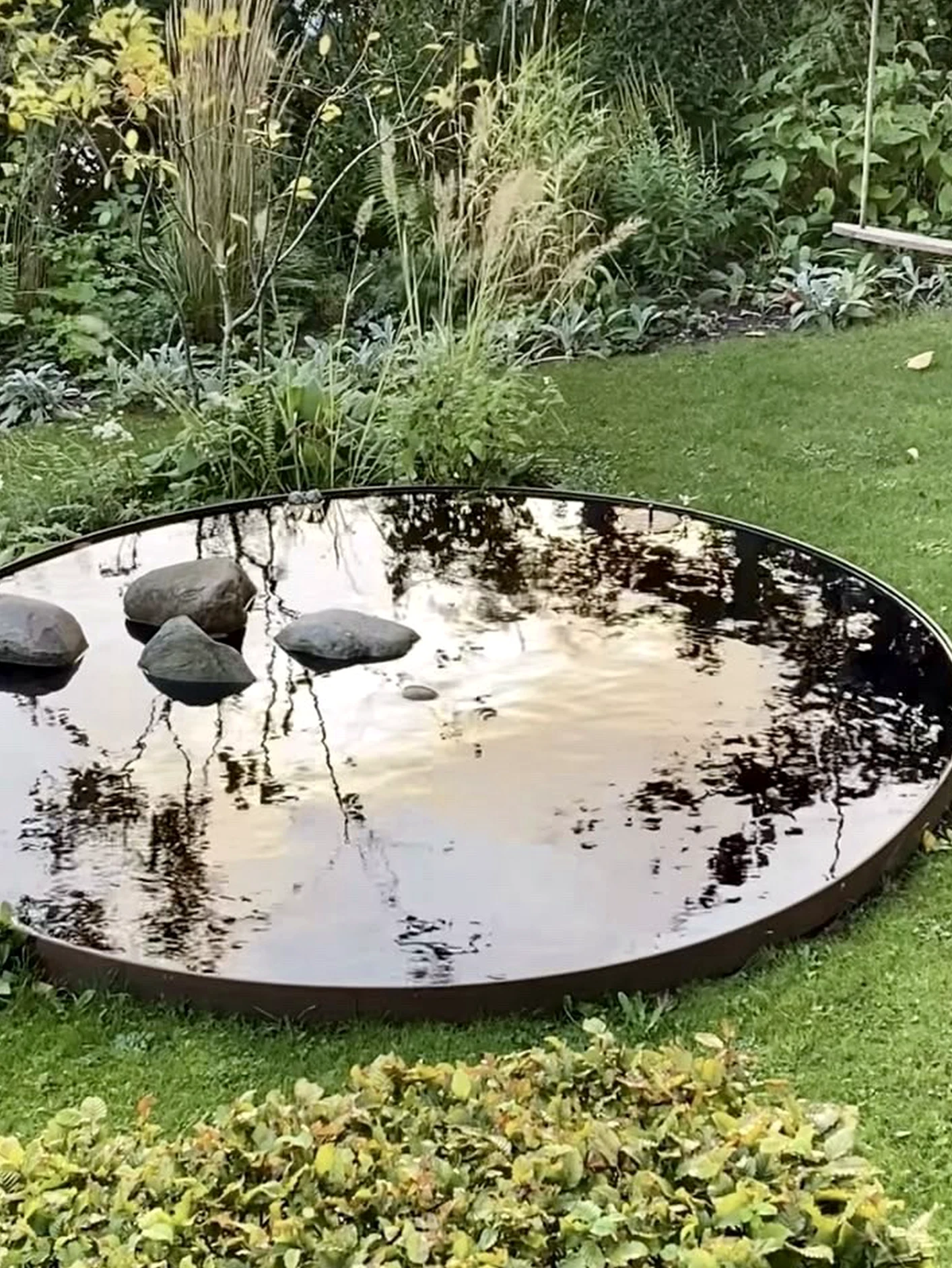 Graceful decorative mirror adds focus across the outdoor space, giving the decor a finish that feels ready for quiet use.